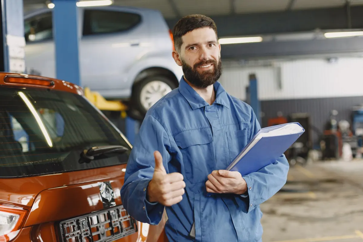 AutoFix mechanic servicing a car at a customer's home in Islamabad